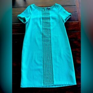 Limited shift dress with crotchet details on the front and back. Size small.